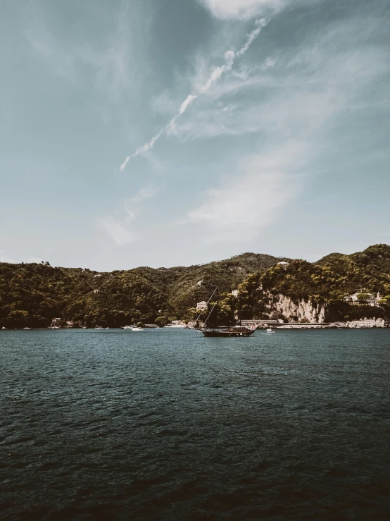 an island sits out in the middle of a lake