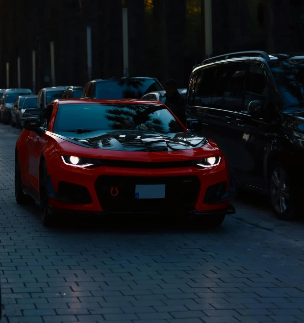 several cars are sitting on the side of a street