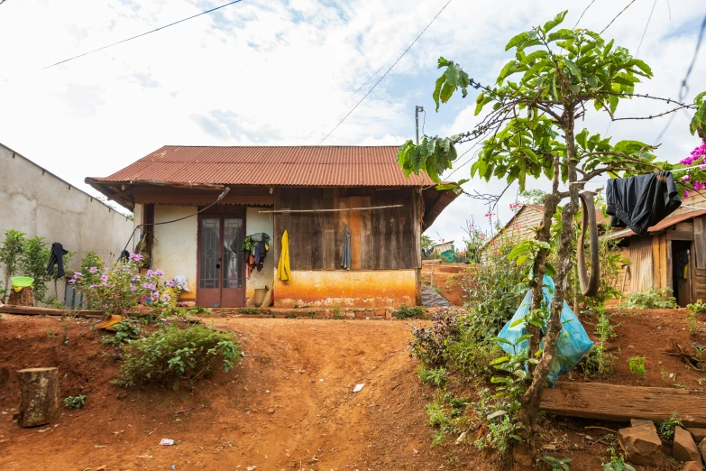 a small house with a window over looking a field