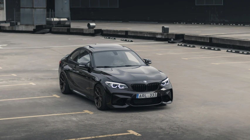 an image of the front view of a black sports car