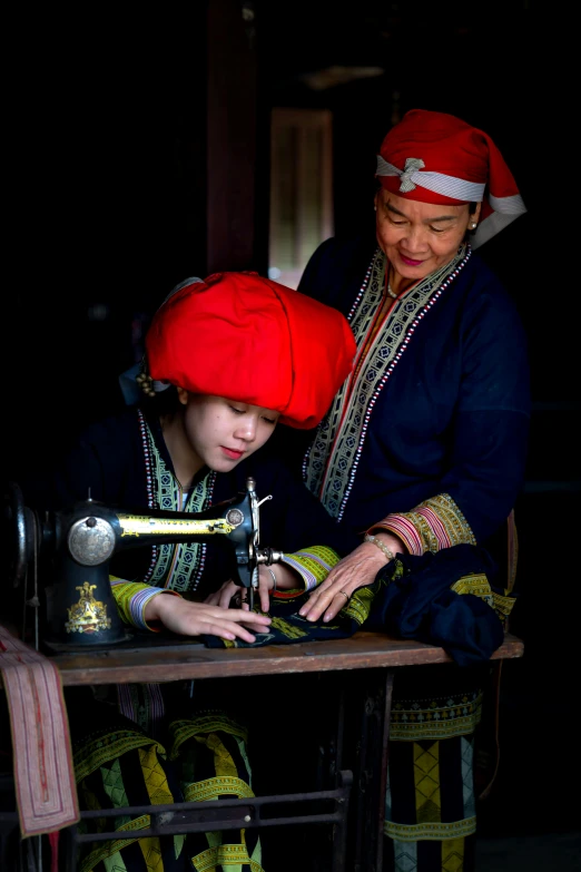 a woman is standing next to a  in the dark