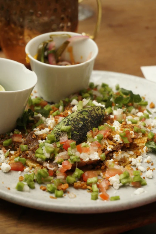 a plate full of food and bowl filled with salad