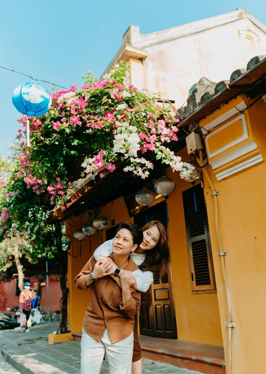 two women are smiling and emcing in the street