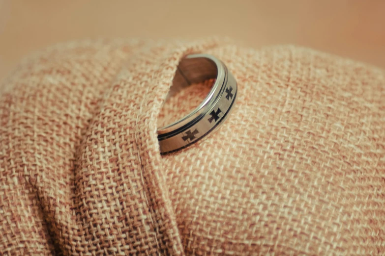 a close up s of a ring on a burlocks cloth