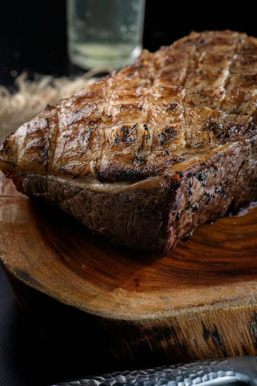 a piece of meat sitting on top of a  board