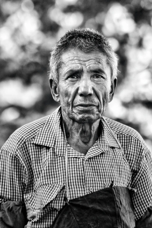 black and white po of a man wearing a shirt