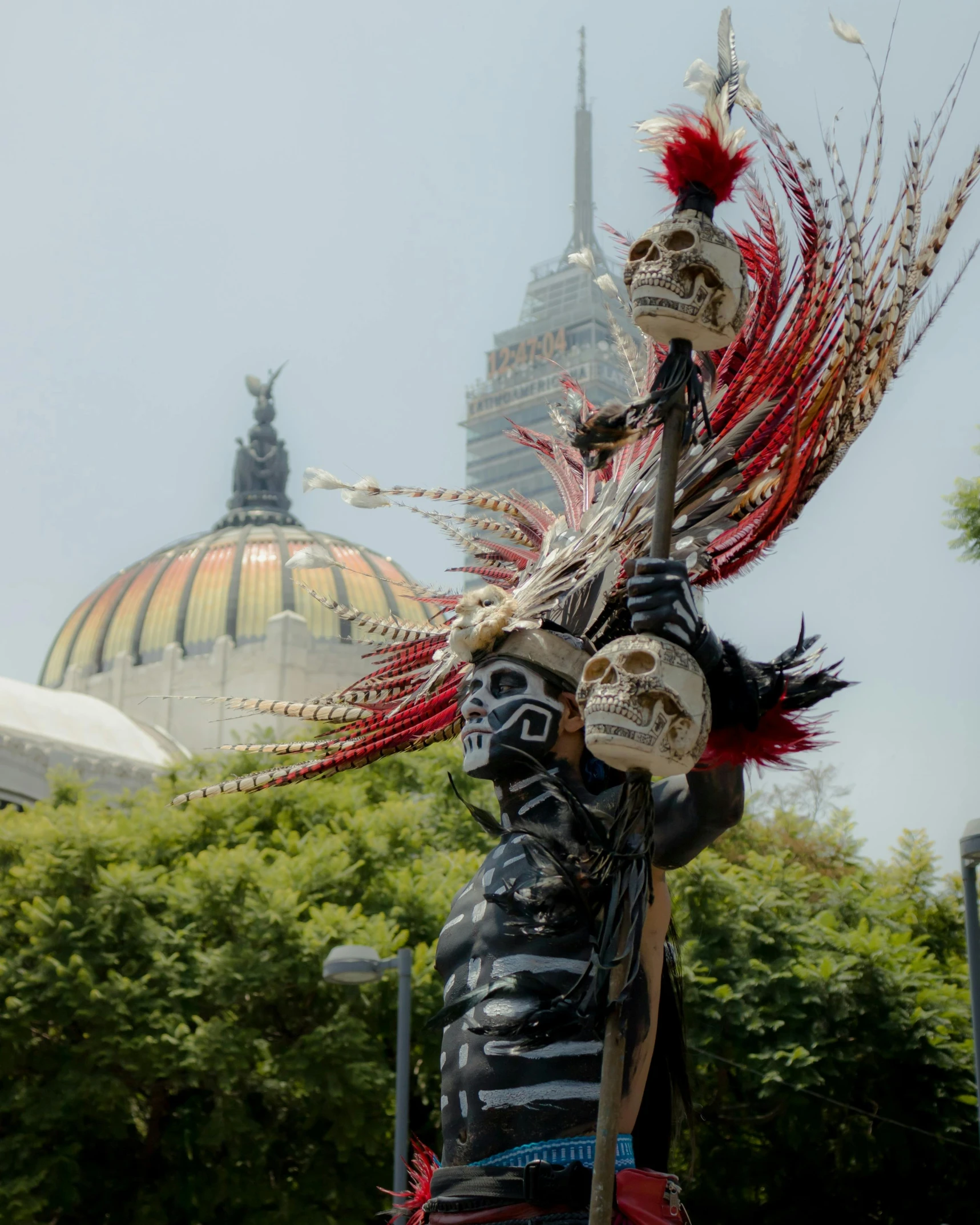 a statue dressed in costume outside of a building