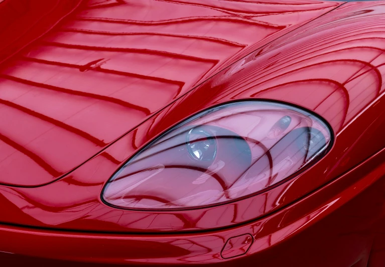 red sports car hood showing the top grill