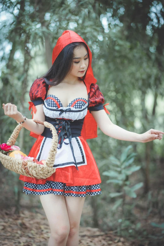 a woman dressed in a costume carrying a basket