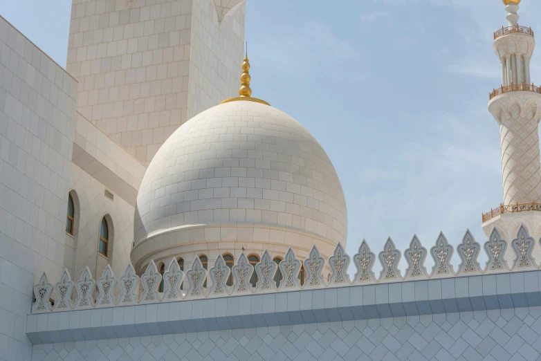 an elaborate white building has a dome