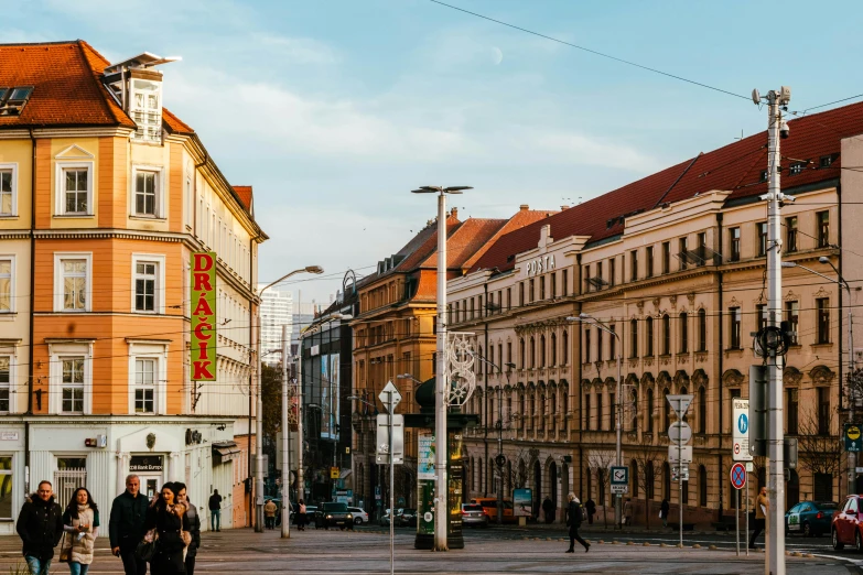 a street is crowded with people crossing the street