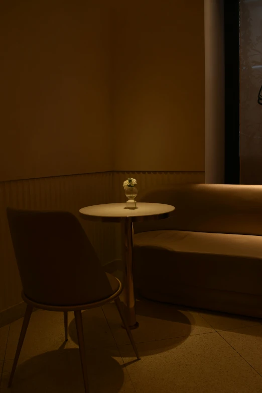 a couch and table with a clock on the wall