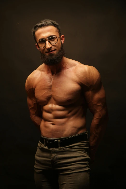 a close - up of a shirtless man in glasses and shorts