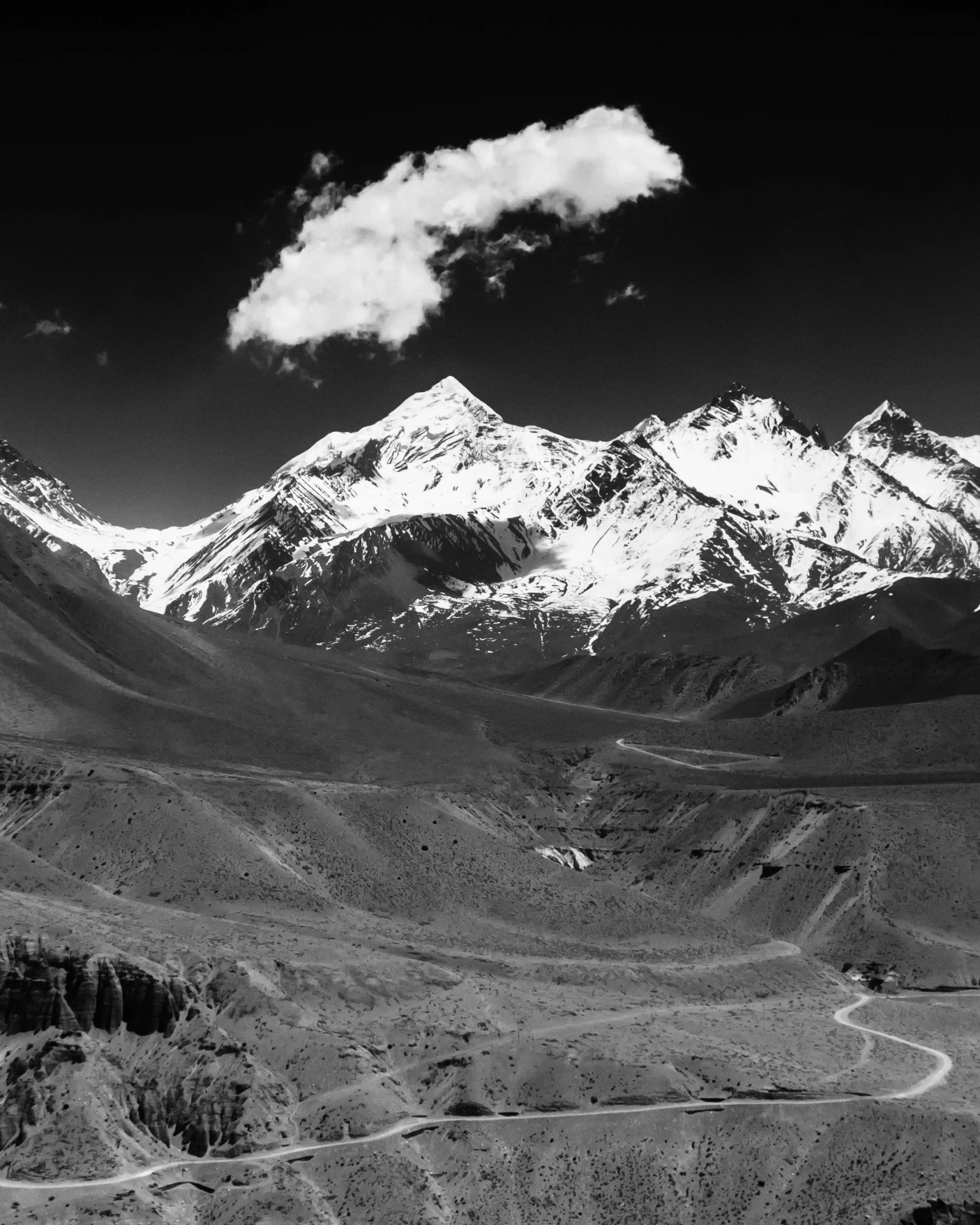 an image of mountains with roads in the foreground