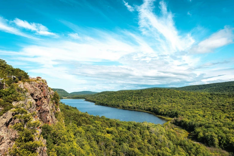 a body of water sitting next to a mountain top