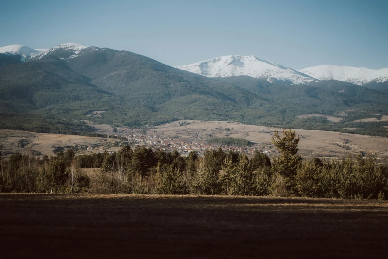 the view of a valley and some mountain range