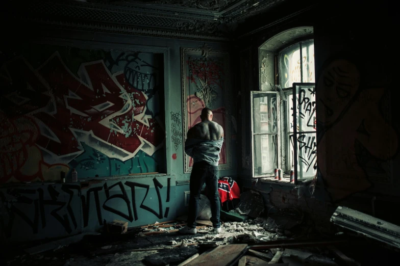 a person standing in front of a window in an empty room