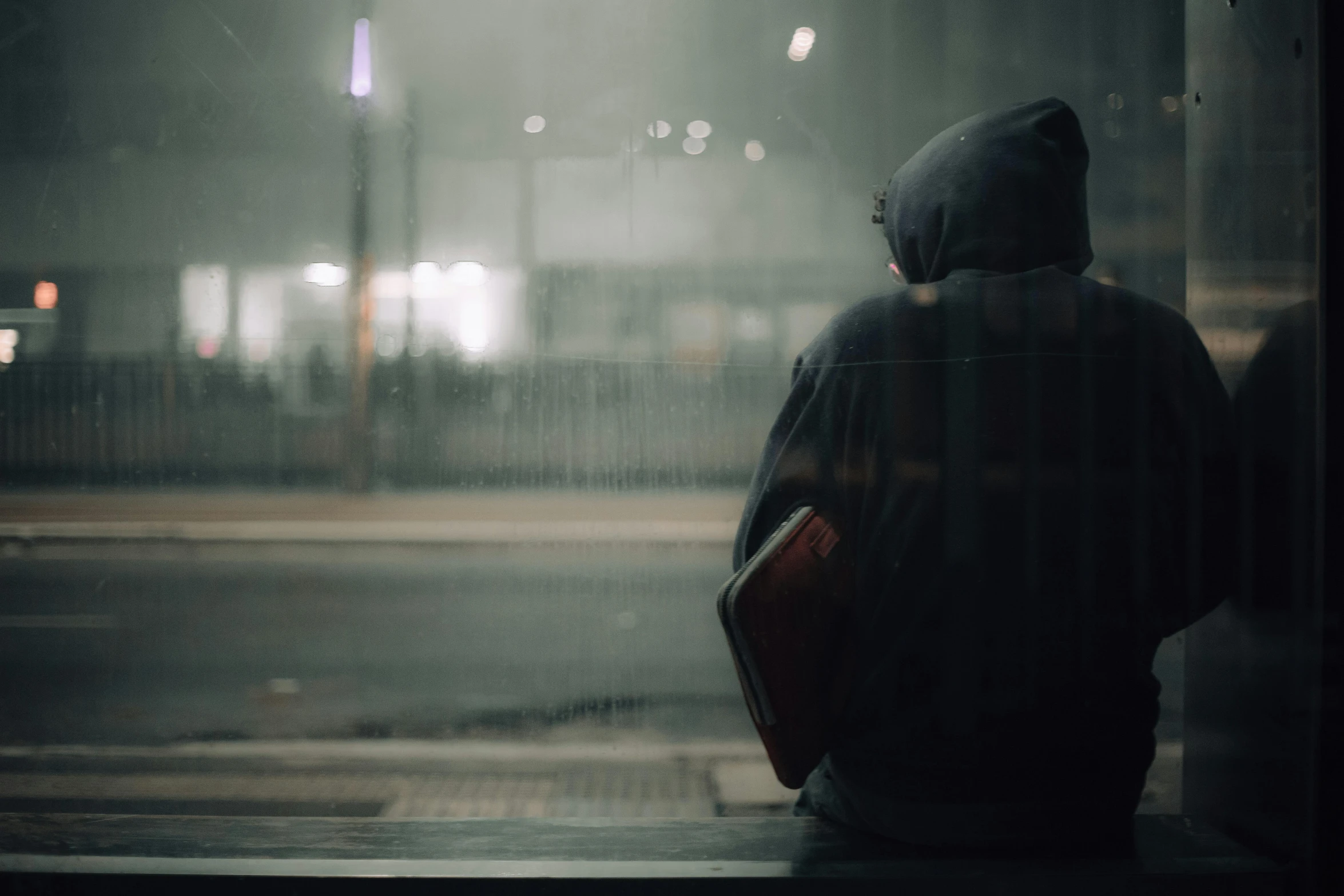 a person is walking on a sidewalk with a backpack