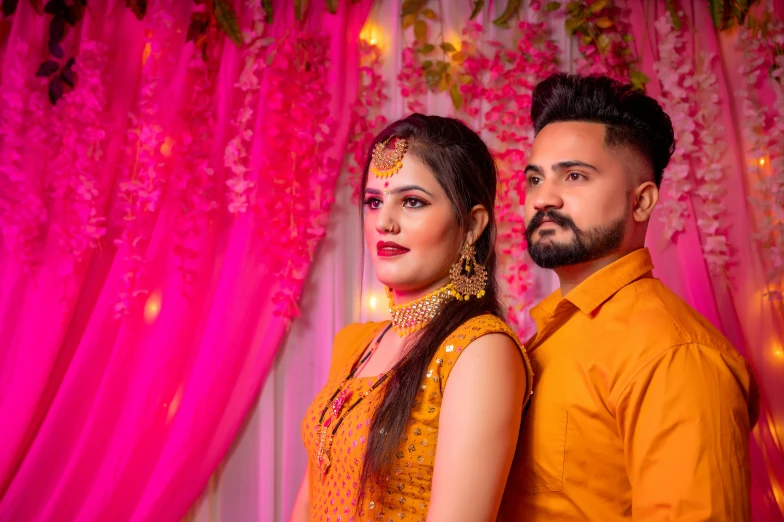 an indian couple are posing together at their wedding