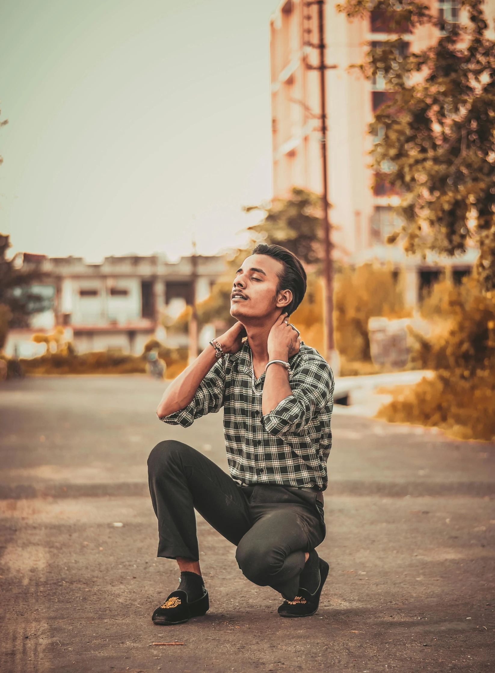 a man kneeling down with his foot on the ground