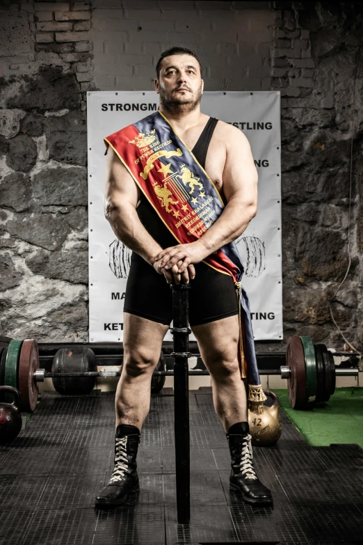 a man holding a weight scale in his left hand