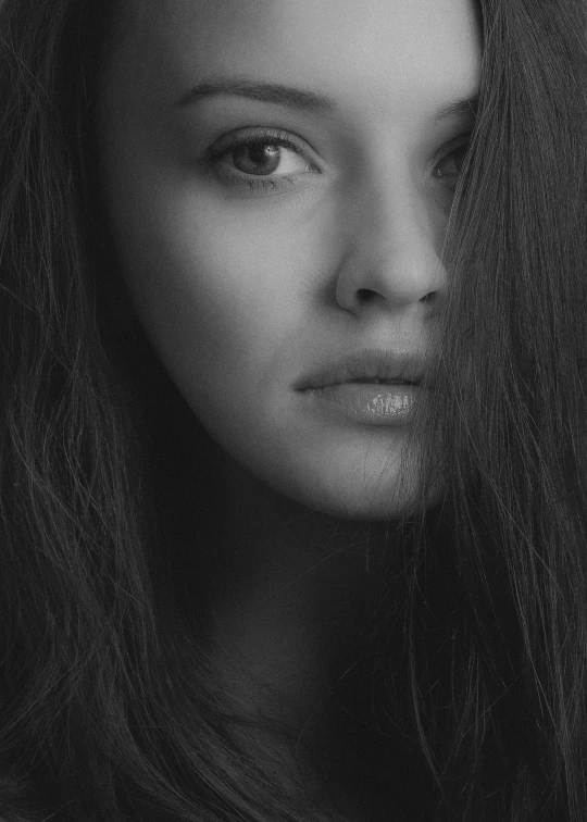 a woman with long hair and a concerned look