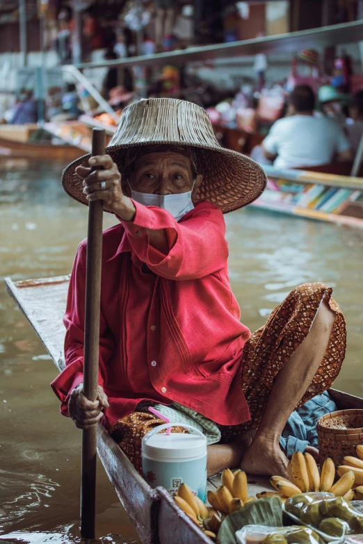 a woman is sitting on the back of a boat