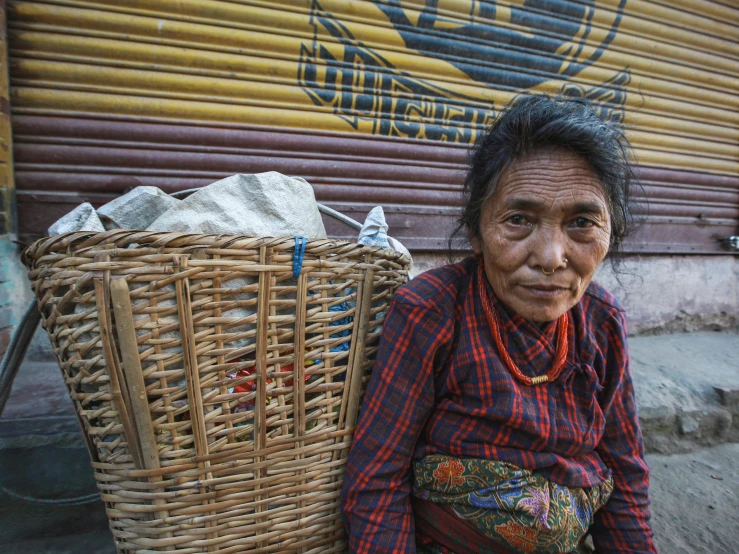 a woman holding a basket in her hand