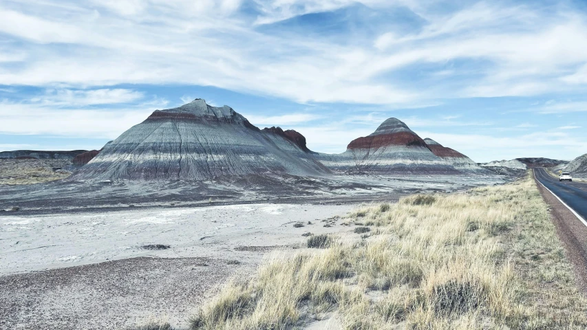 a group of tall mountains near the desert