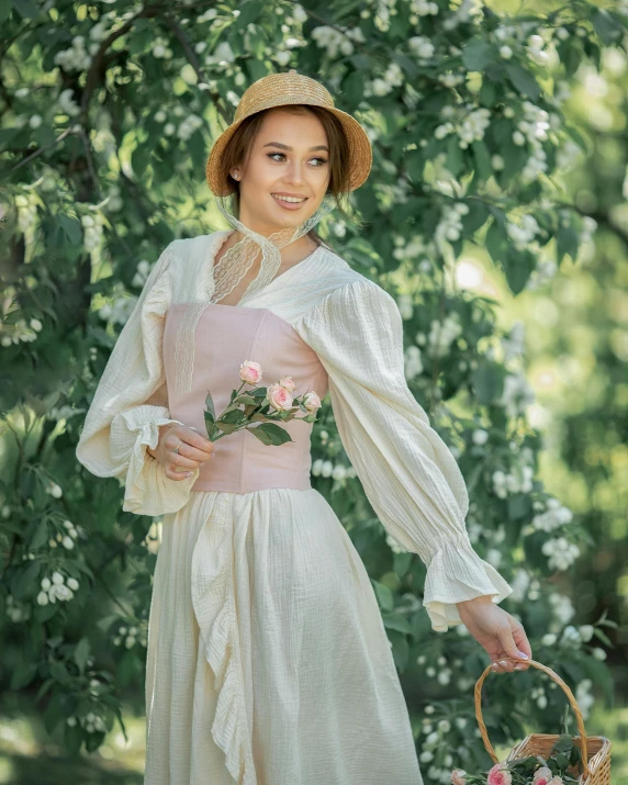 a lady in a white dress and hat poses for a po