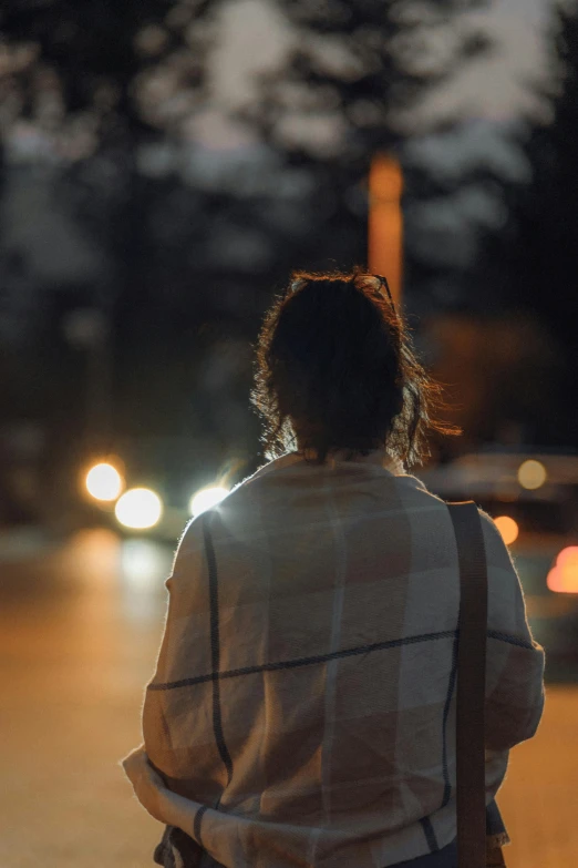 a person standing with a blanket on