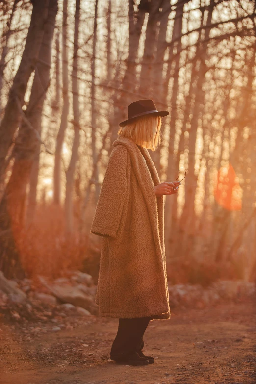 a person standing on a path in the woods