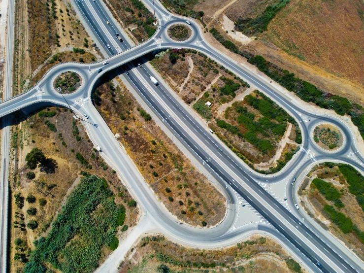 an aerial view shows roadway intersections on either side of a roadway