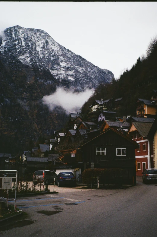 small village, with mountains covered in snow