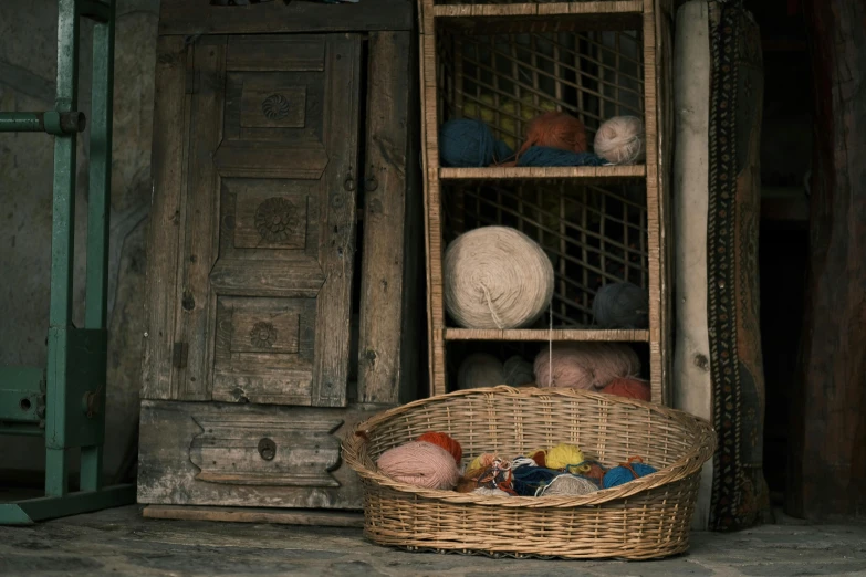 baskets full of yarn are next to a set of doors