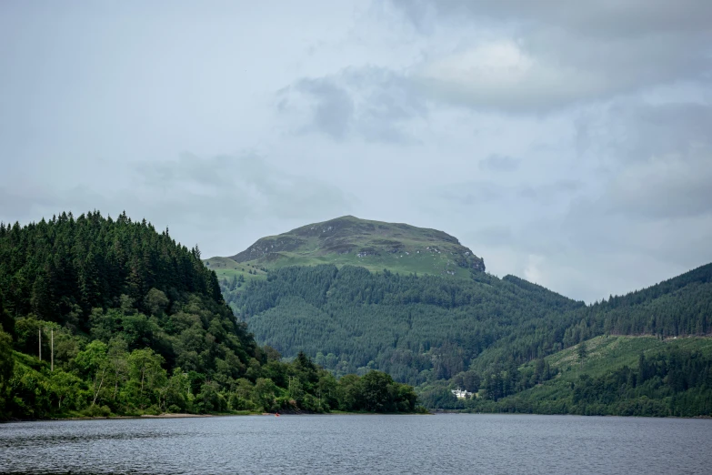 the view of a lake, mountains, and forest