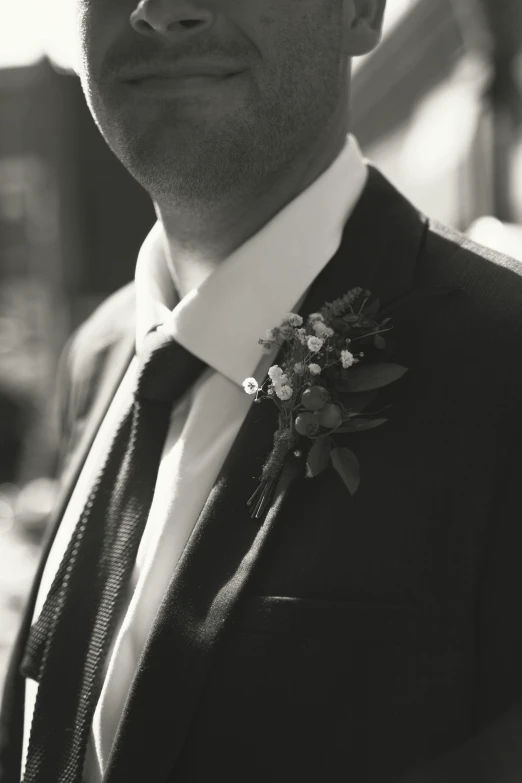 a close up po of a man wearing a suit and tie
