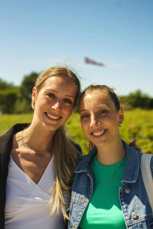 two smiling women standing next to each other