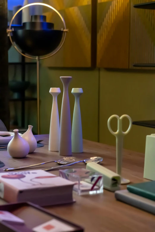 various small vases and paper on a table