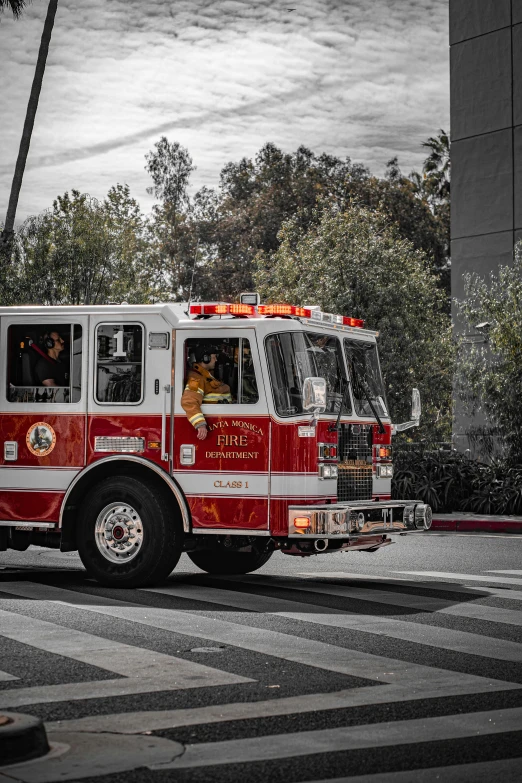 a small fire engine driving down a street