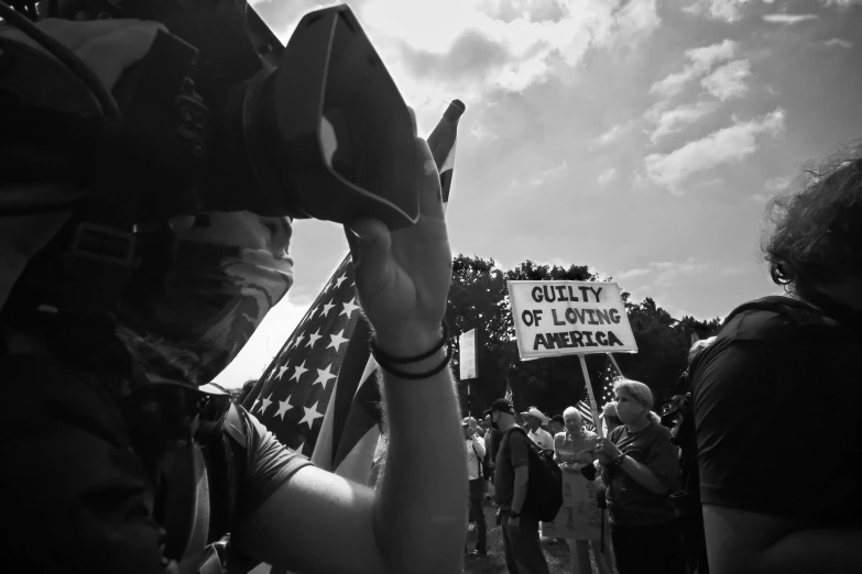 people are holding a banner and hats in front of a crowd