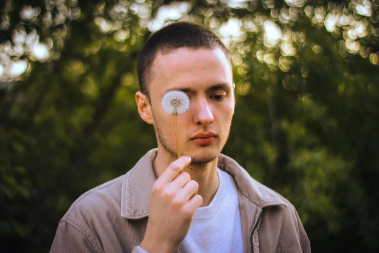 a man wearing a jacket looking up into the sky