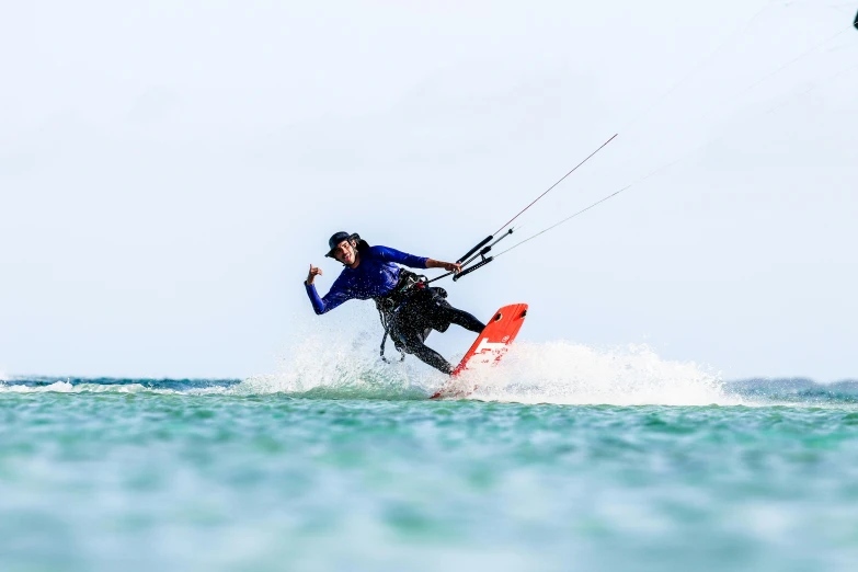 a man that is on some water with a board