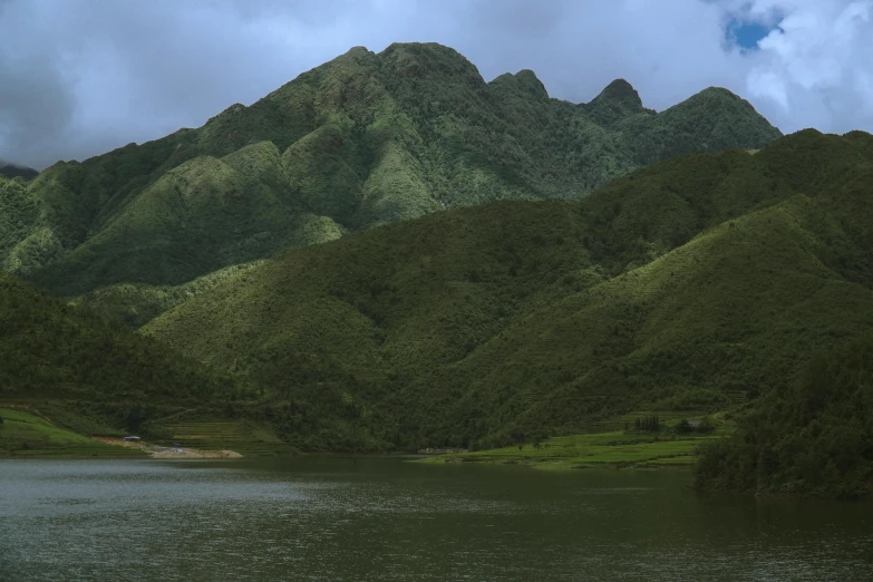 a boat that is out on the water near some mountains