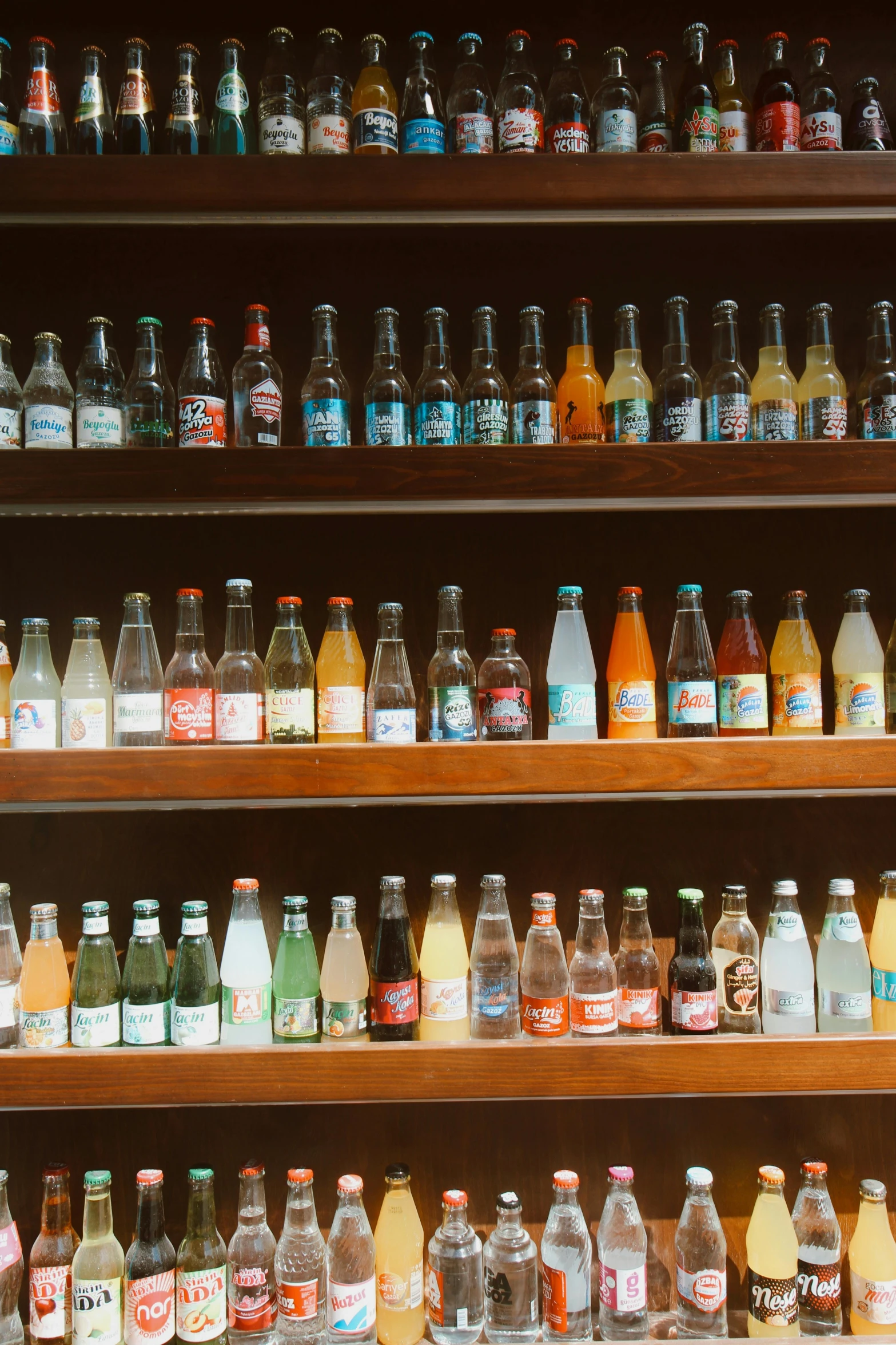 shelves full of various beverages are stacked high