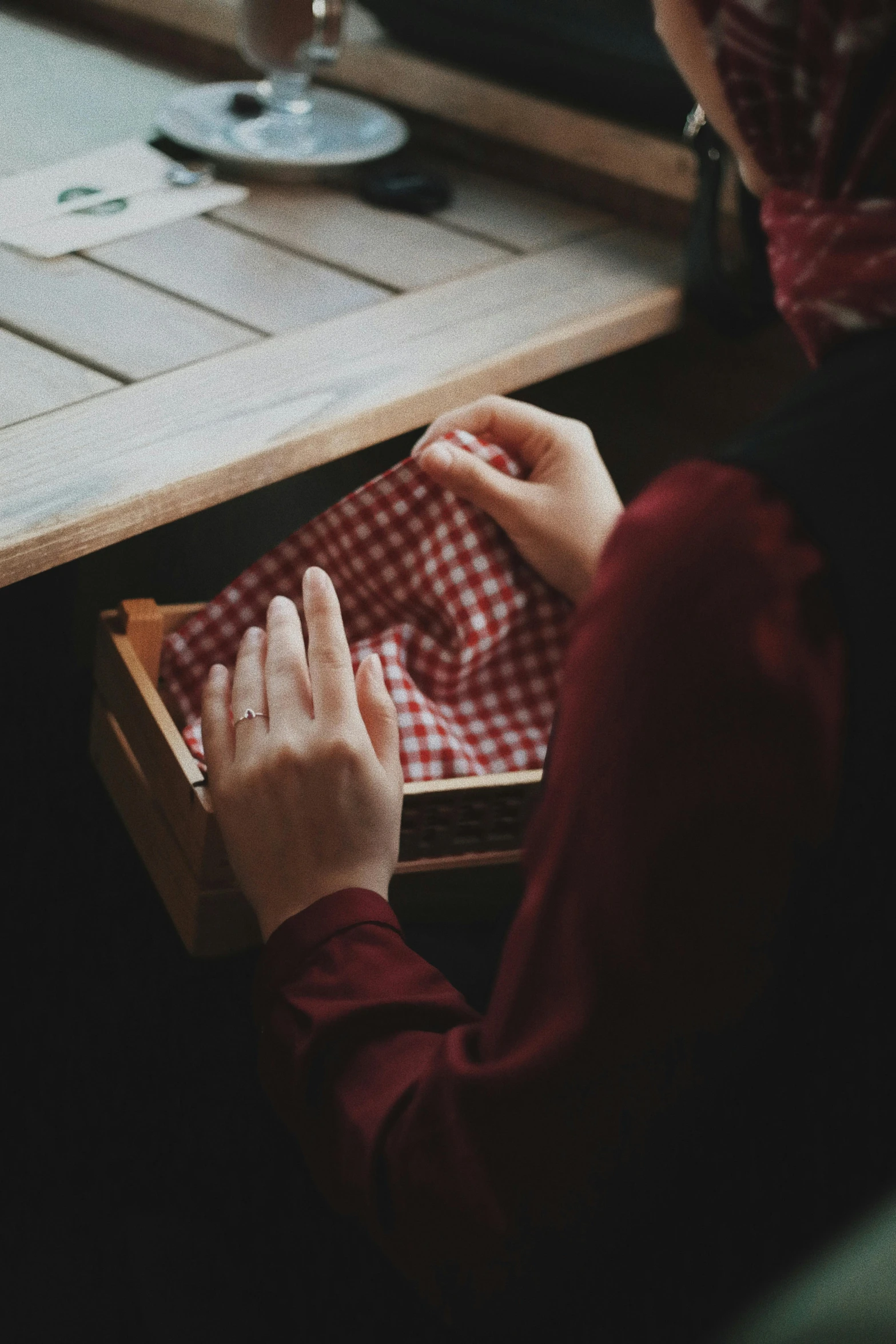 a woman in a red shirt and some napkins