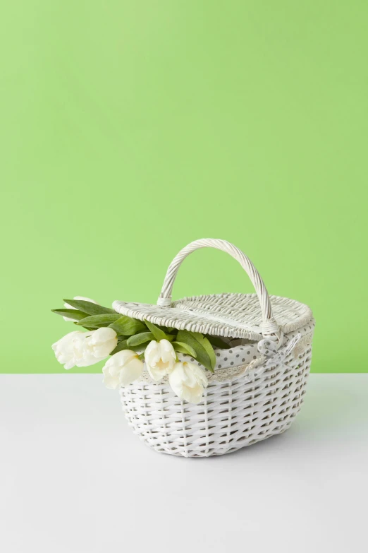a basket with flowers laying on a table