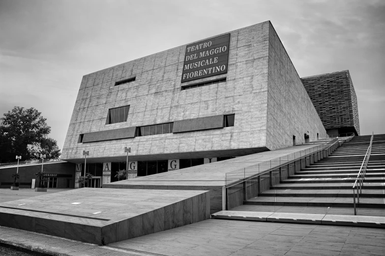 an artistic building with a staircase leading to it