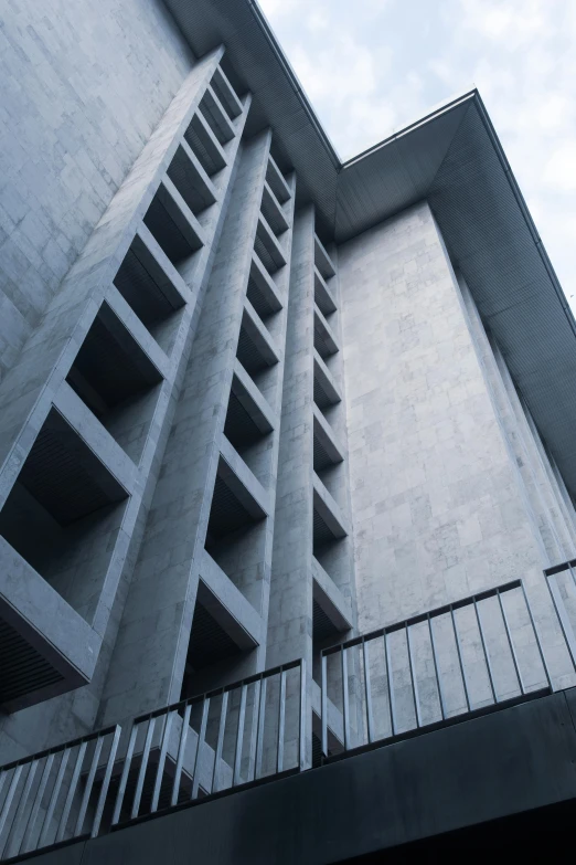 a building with some columns and a staircase up the side