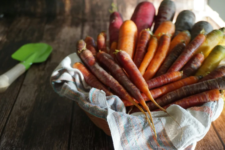 carrots and other vegetables on a wooden table